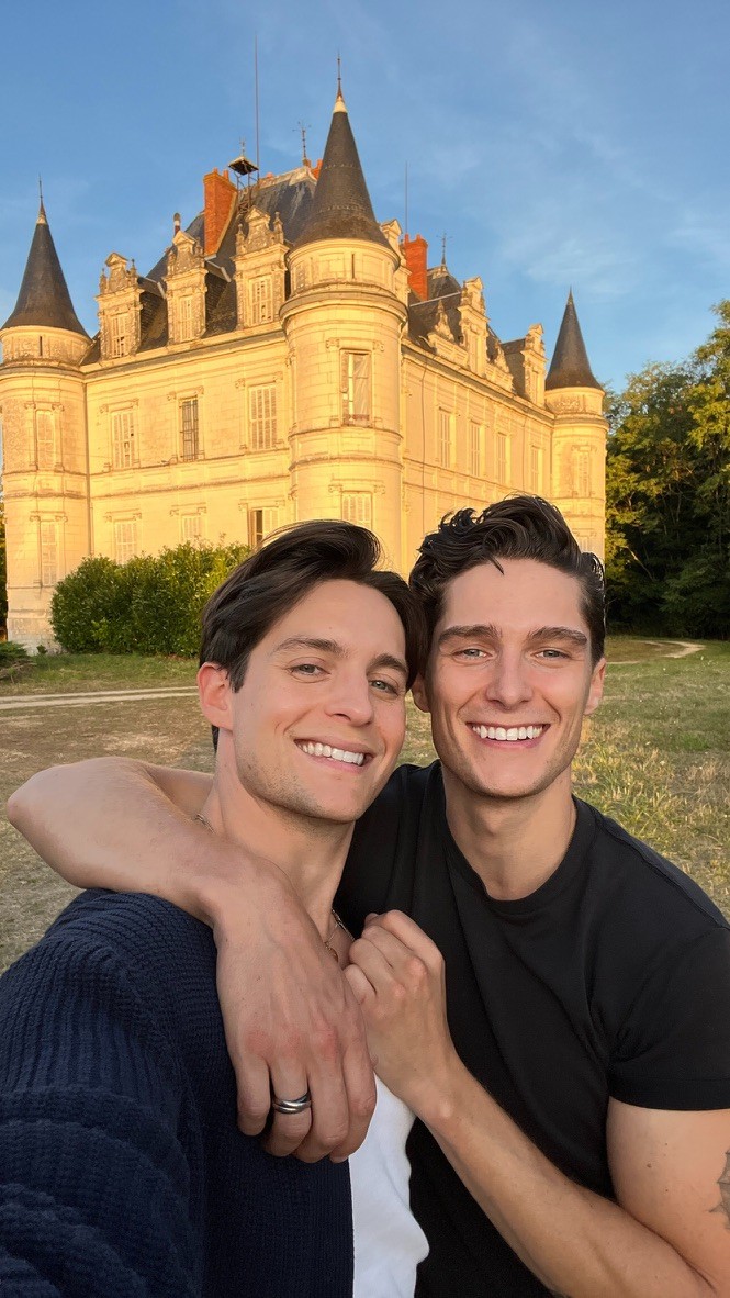 Tom and Damien in front of the château at golden hour